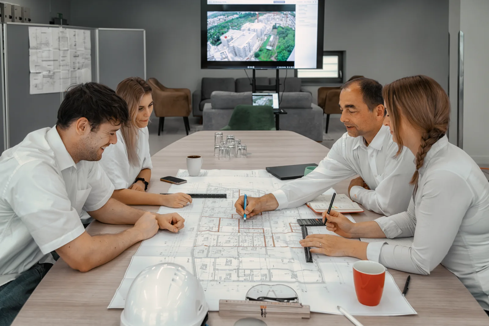 Project meeting with plans on the table